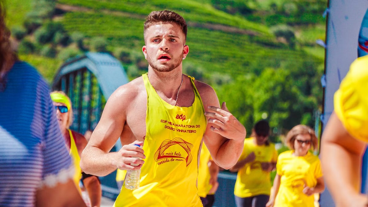 Focused runner participating in an outdoor marathon, showcasing endurance and fitness.